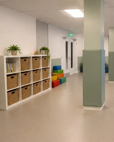 The play area at our centre, with basket shelving, colourful soft play blocks and padded pillars